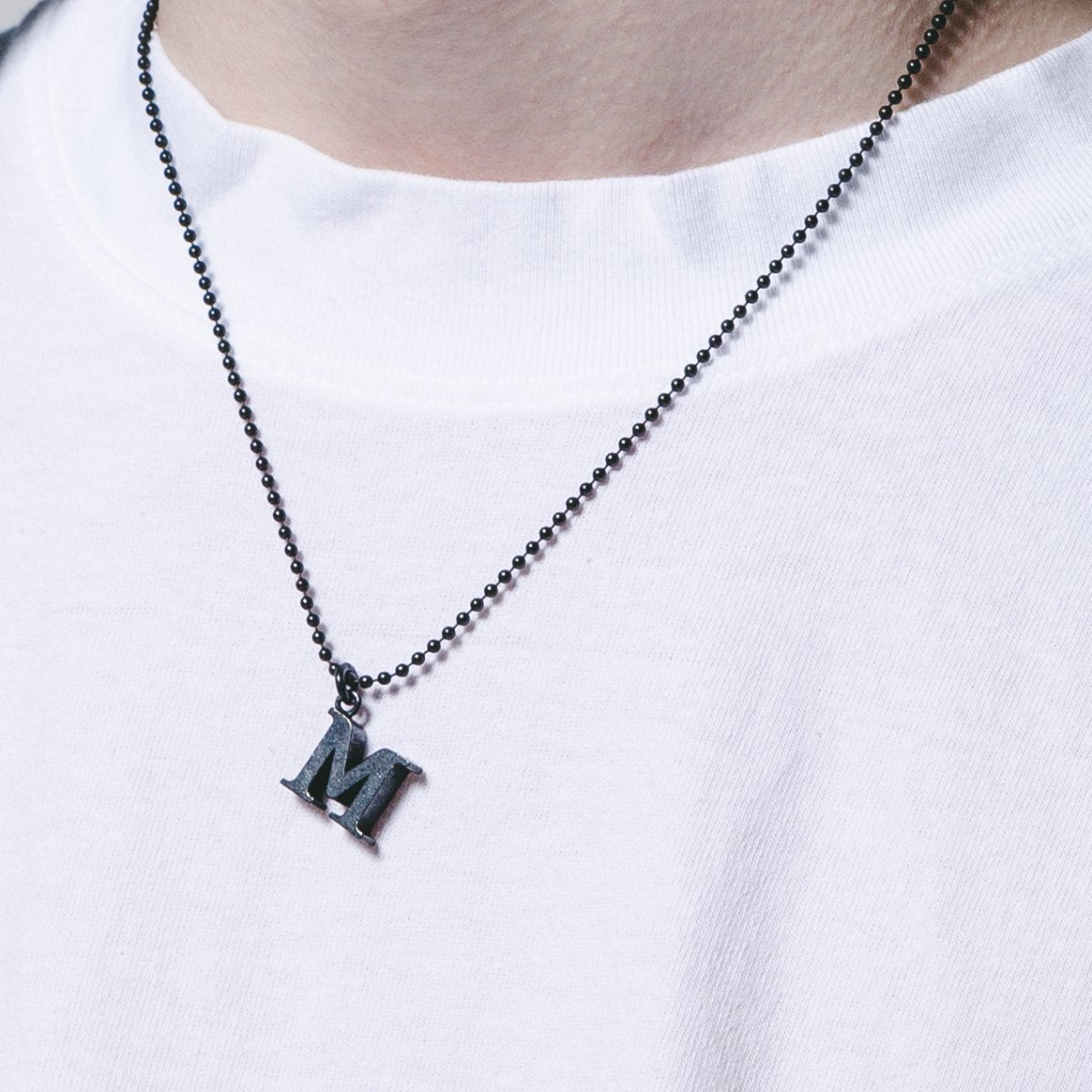 MUZE - M LOGO NECKLACE (MATTE BLACK) ミューズ ロゴ ネックレス