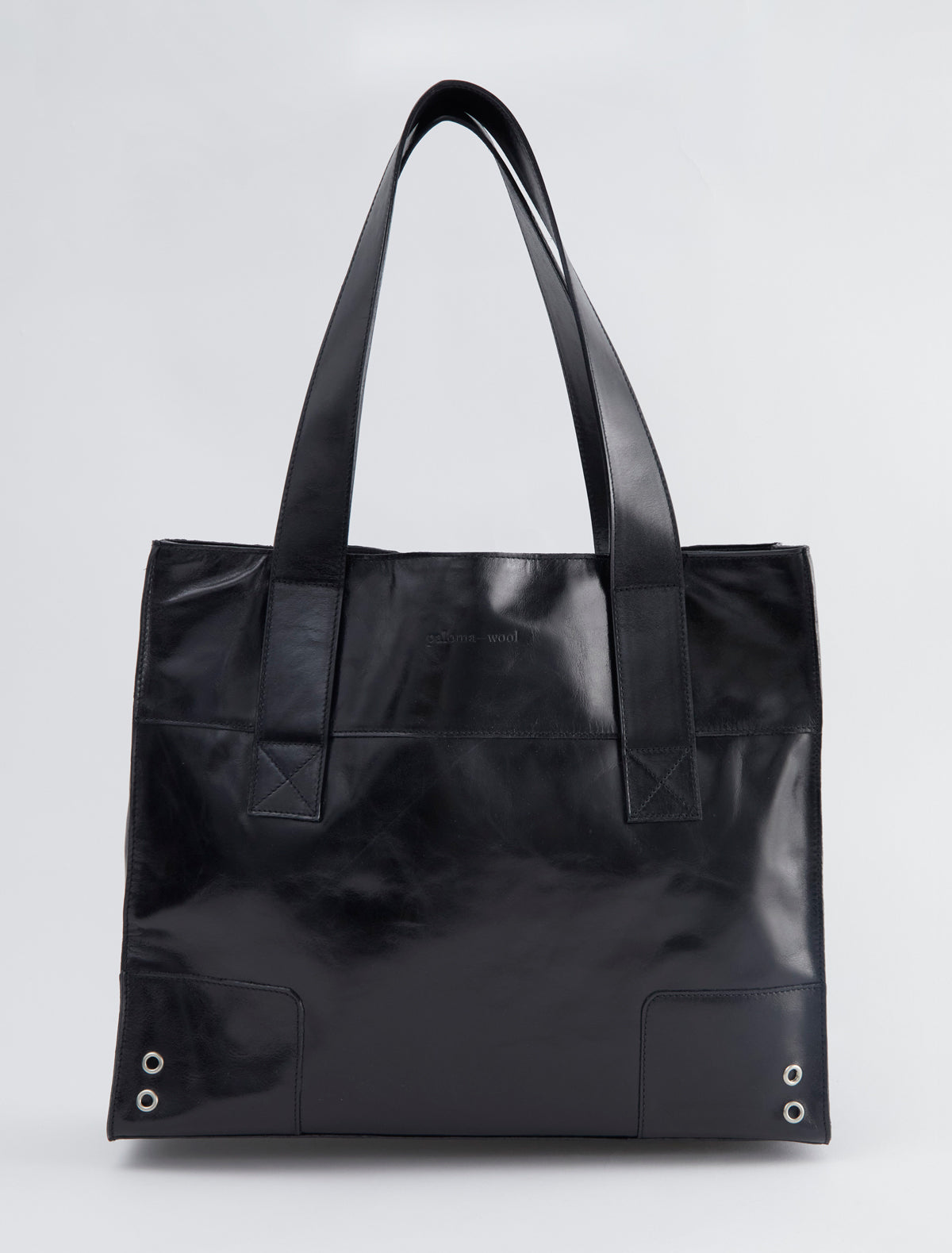 MARGA-Black square sack-style bag with silver grommet details