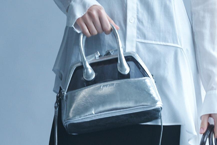 ディスコード ヨウジヤマモトのユニセックスバッグ - サイドジップを配