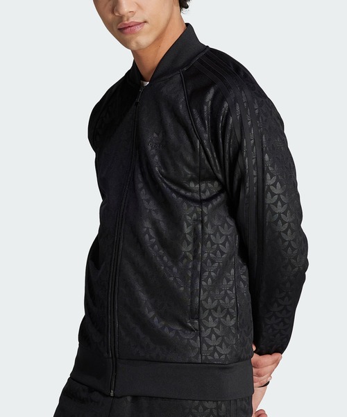 adidas（アディダス）の「グラフィック モノグラム SST トラックトップ