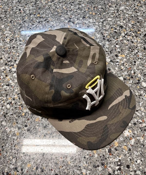 MUSINSA | AEAE AE SYMBOL ANGEL WING CAP [CAMO]