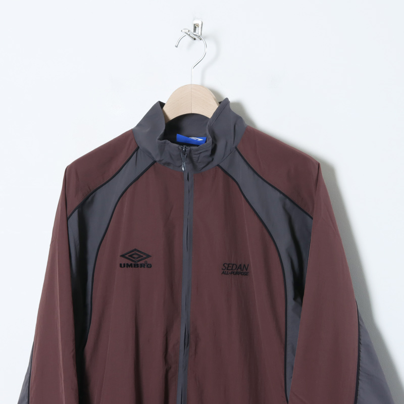 SEDAN ALL-PURPOSE (セダンオールパーパス) UMBRO Woven Track Jacket