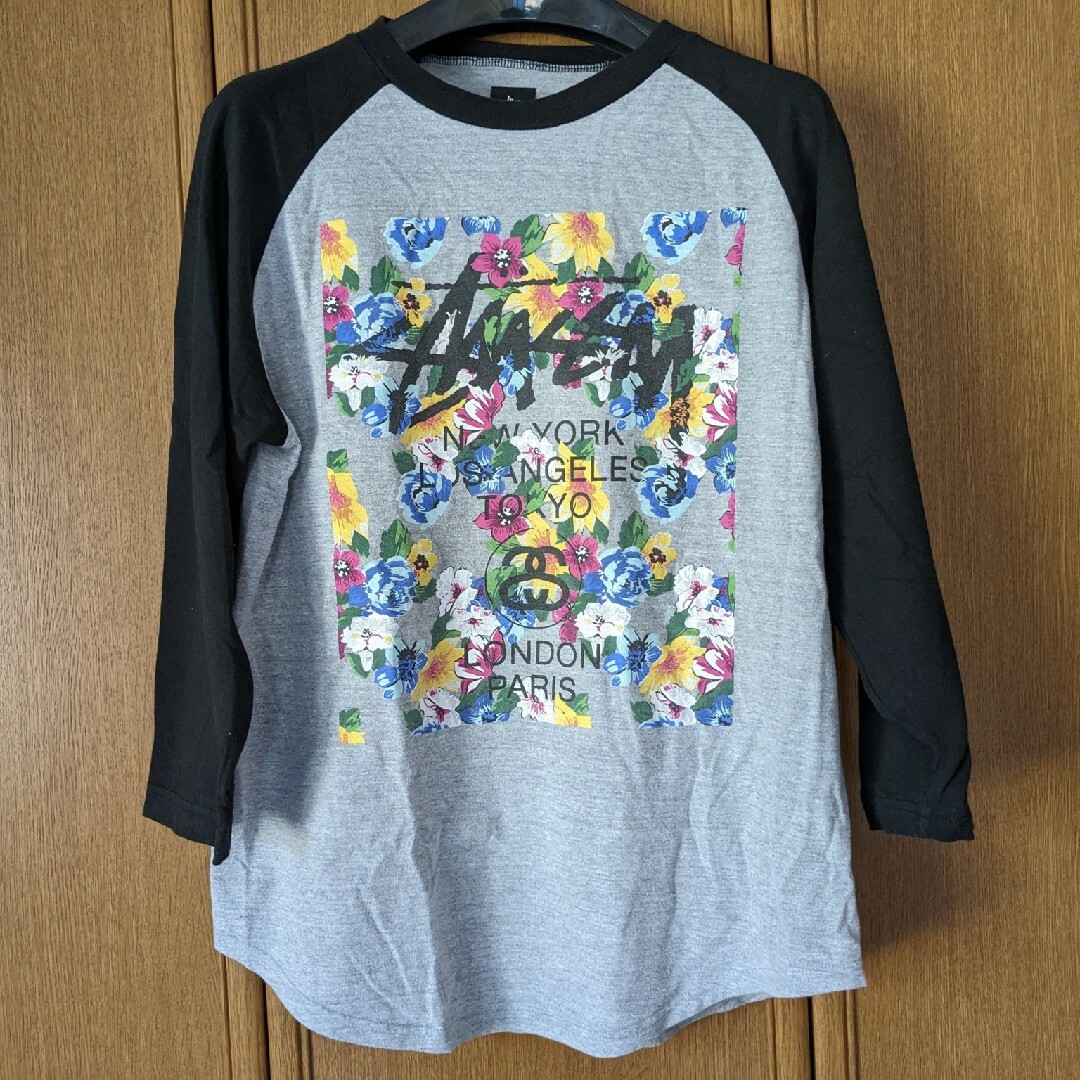 STUSSY - STUSSY 花柄 ワールドツアー 7分袖Tシャツ L 灰色 黒色