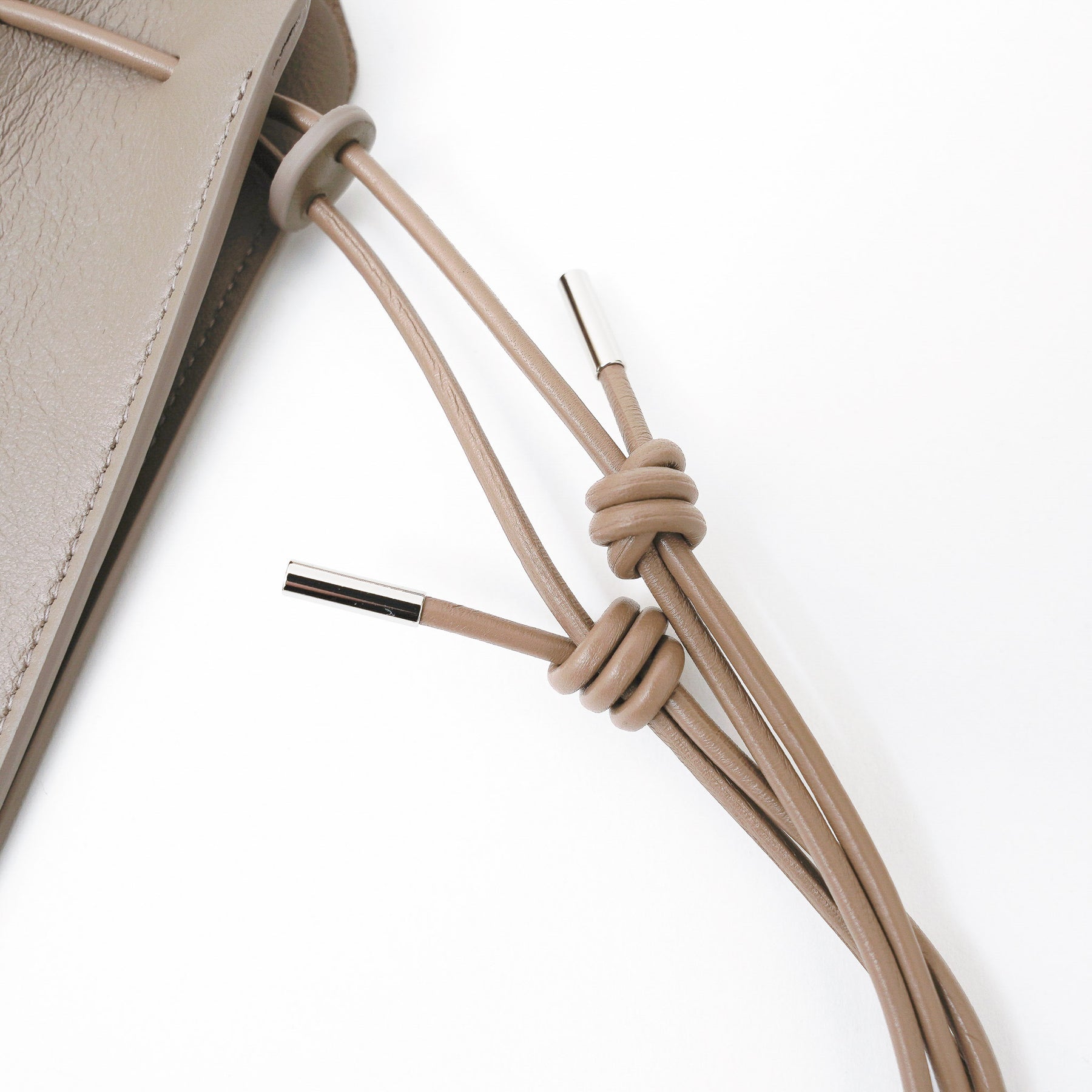 HERRIE KINCHAKU POUCH - XXS / RAPTO FLEX｜レザー ミニ巾着ポーチ 首