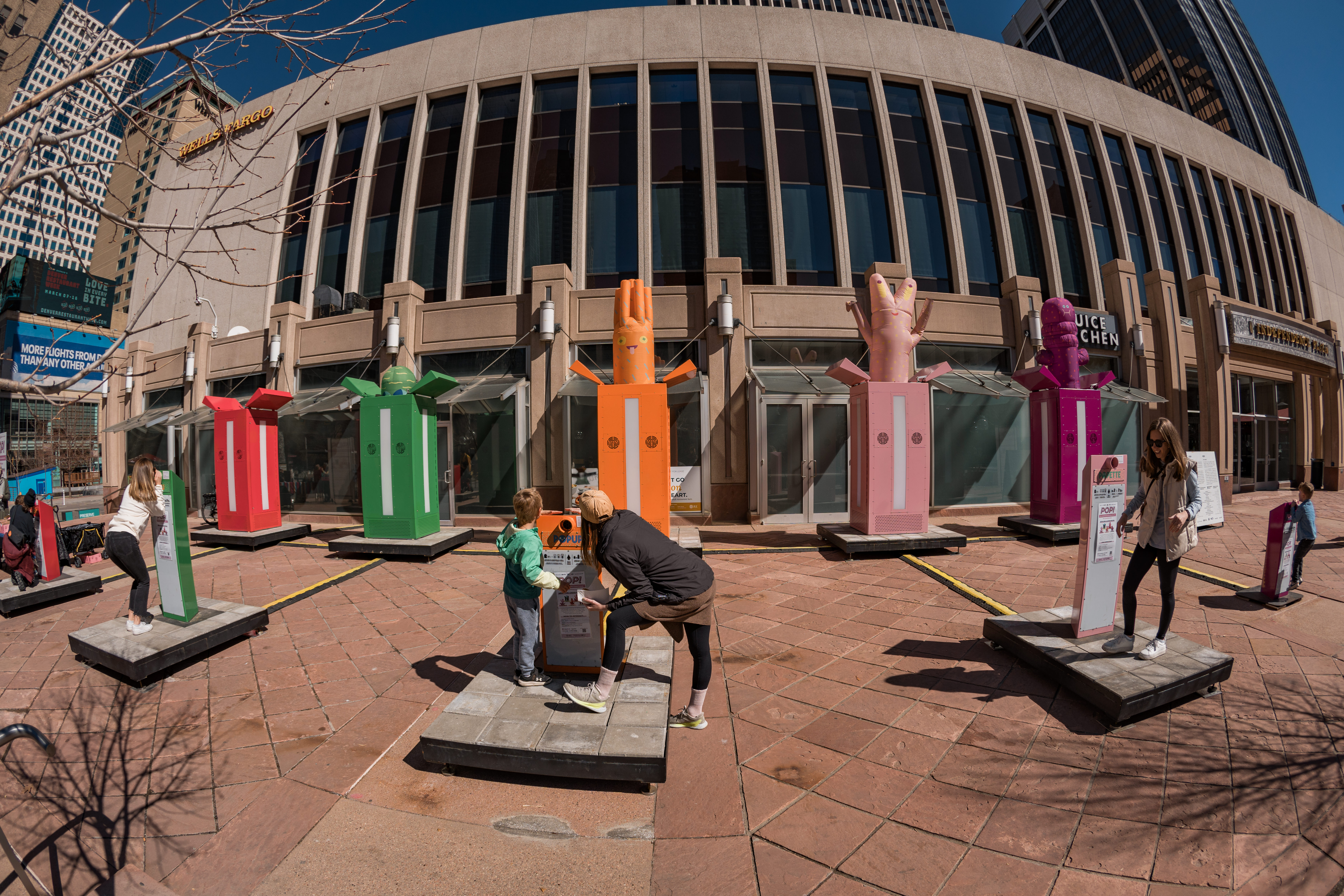 These colorful monoliths are made to yell into at the 16th Street