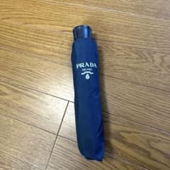 新品】PRADA 折りたたみ傘（ネイビー） - メルカリ