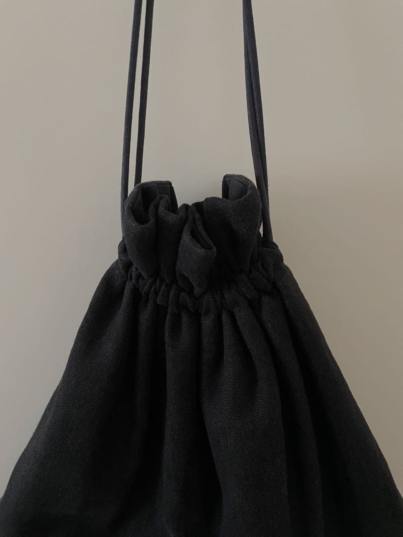 kina ponponbag 黒 巾着型 - メルカリ